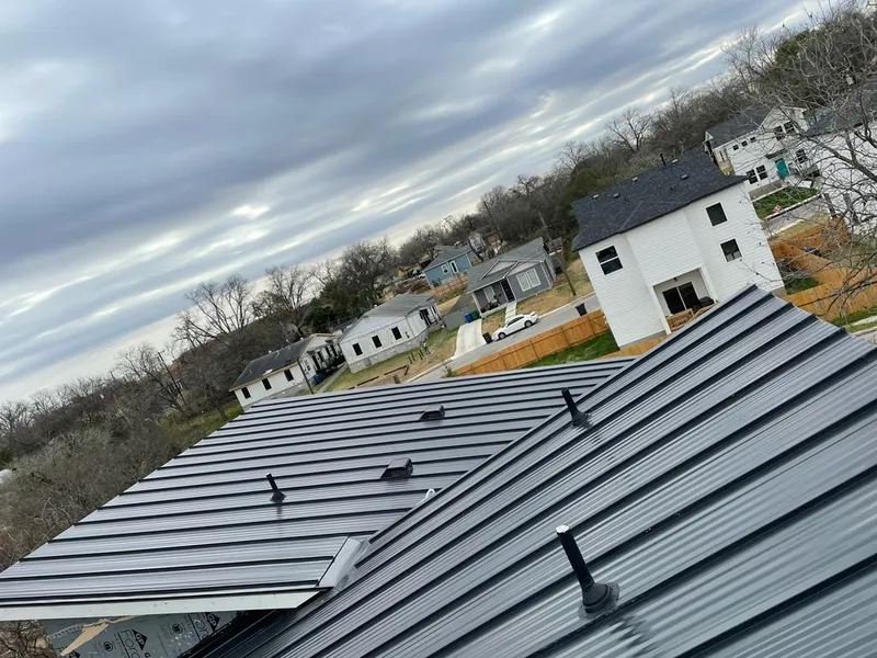 Standing seam metal roof panels with vents for Skylight Repair in Bridge City
